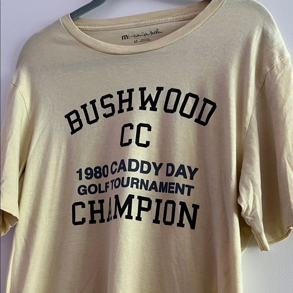 Travis Mathew Cream Bushwood CC Champion Short Sleeve Tee